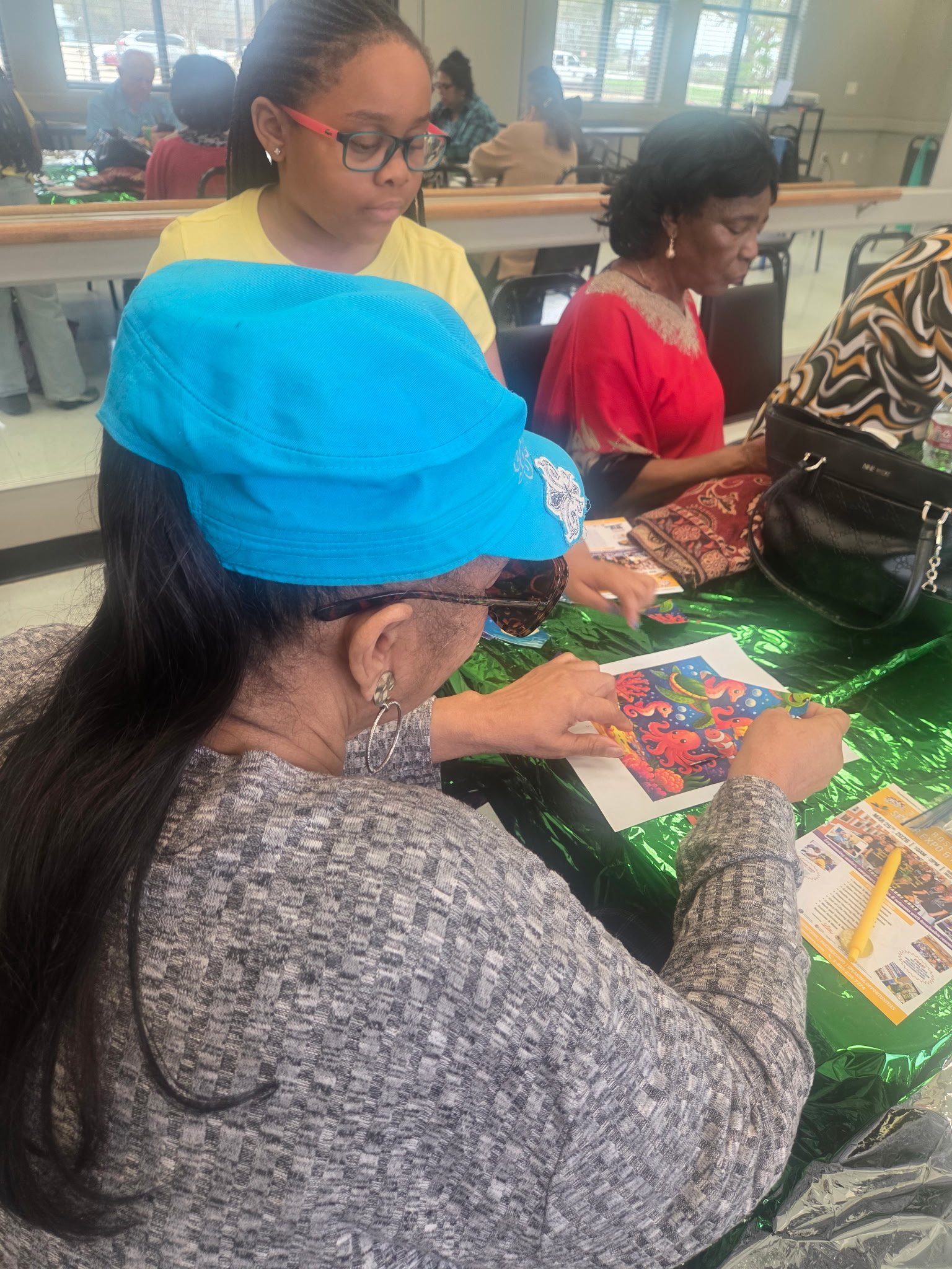 GYSA member working on a craft project at a table