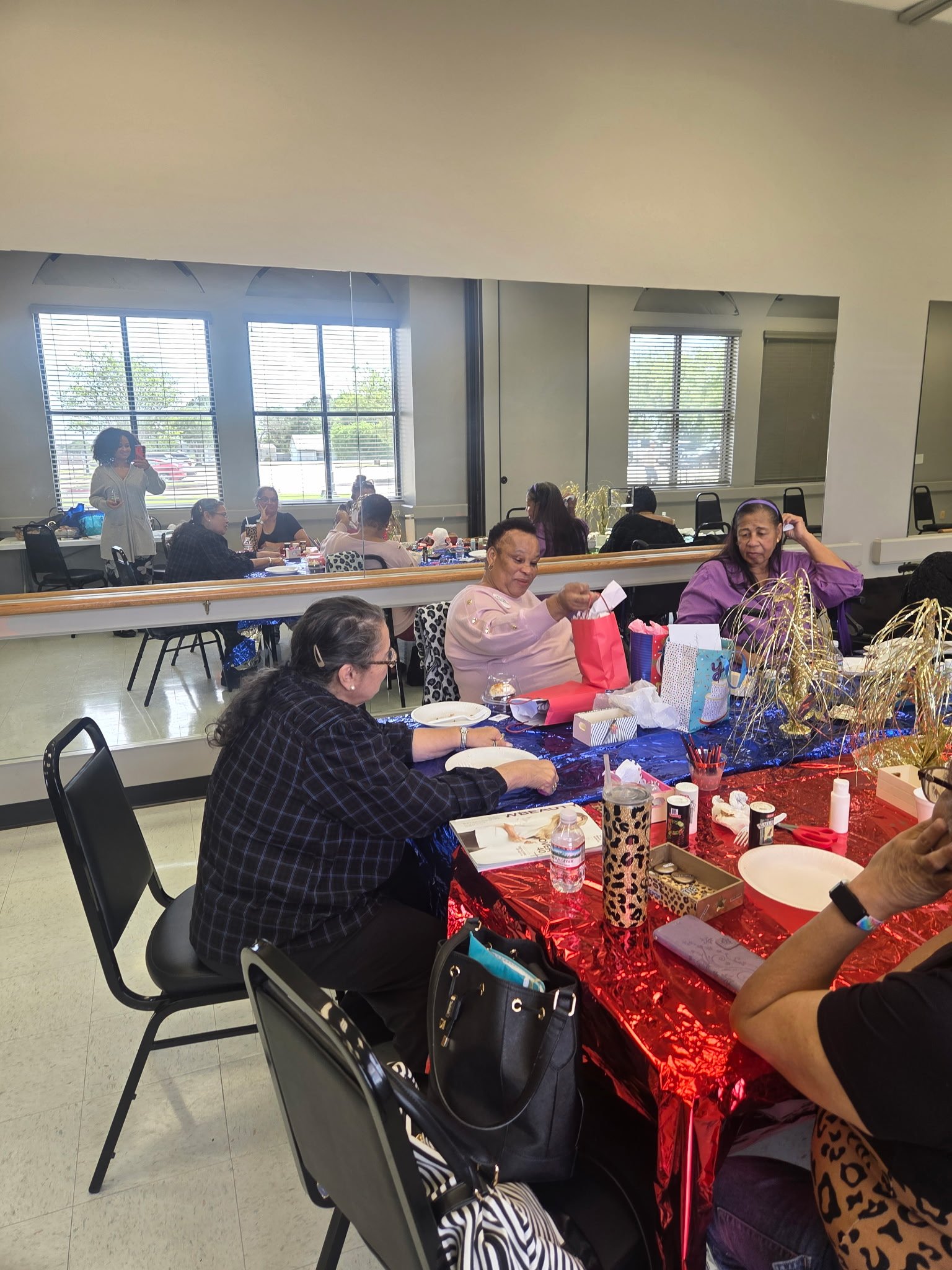 GYSA members gathered together laughing and celebrating at a community event in Rosenberg, Texas
