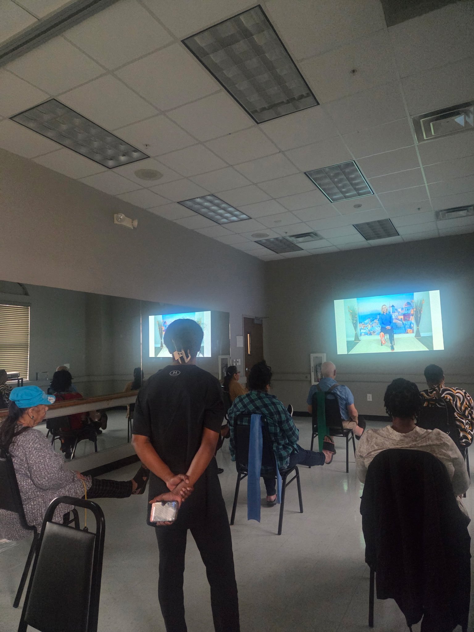 GYSA members participating in a chair exercise wellness class together